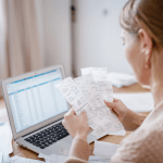 Small business owner figuring out how to manage business expenses and ensuring that business expense categories are correct